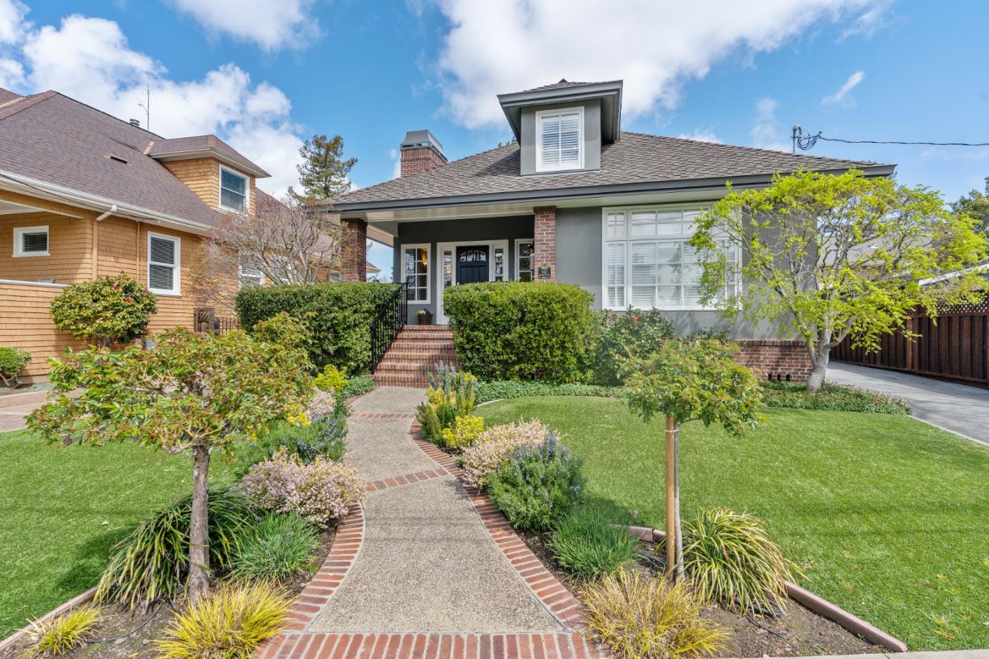 612 Prospect Row San Mateo, CA 94401 - Photo 2 of 54 a front view of a house with a yard