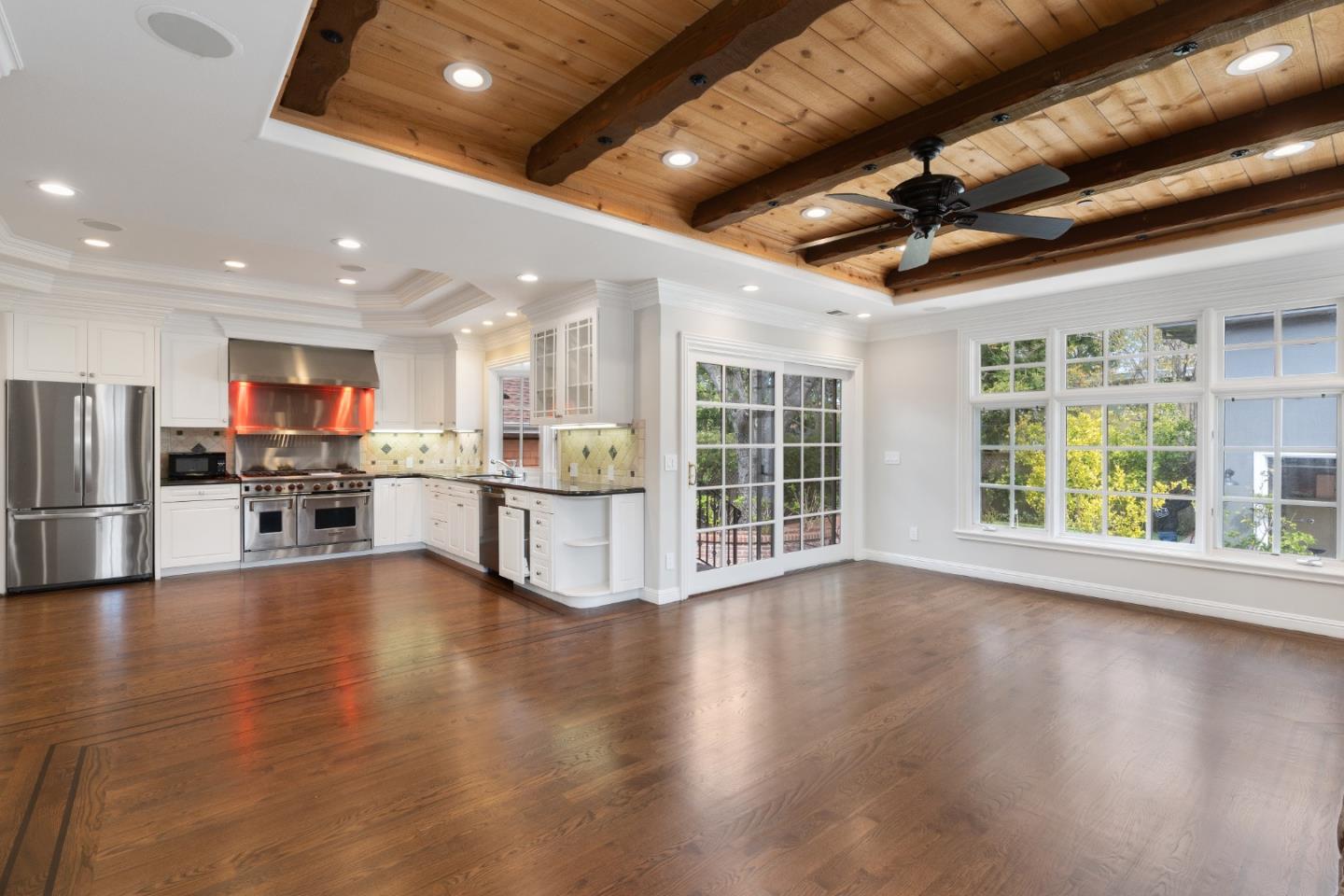 612 Prospect Row San Mateo, CA 94401 - Photo 23 of 54 a view of an empty room with wooden floor and windows