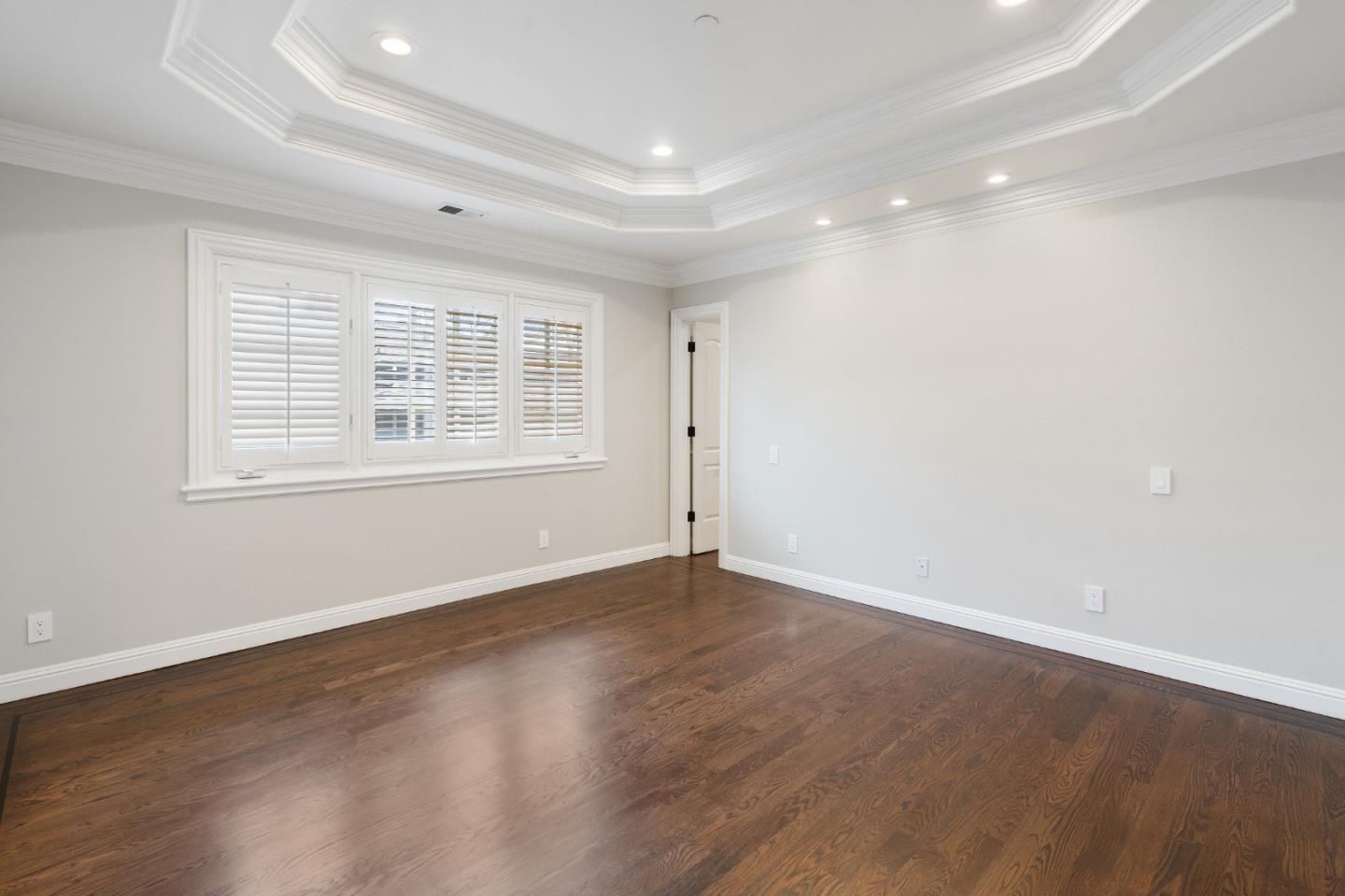 612 Prospect Row San Mateo, CA 94401 - Photo 27 of 54 an empty room with wooden floor and windows