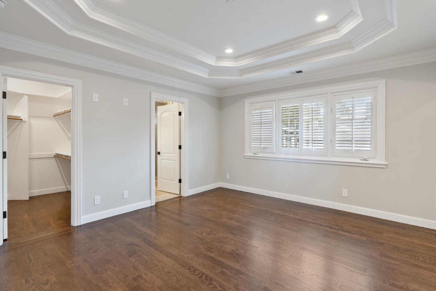 612 Prospect Row San Mateo, CA 94401 - Photo 29 of 54 an empty room with wooden floor and windows