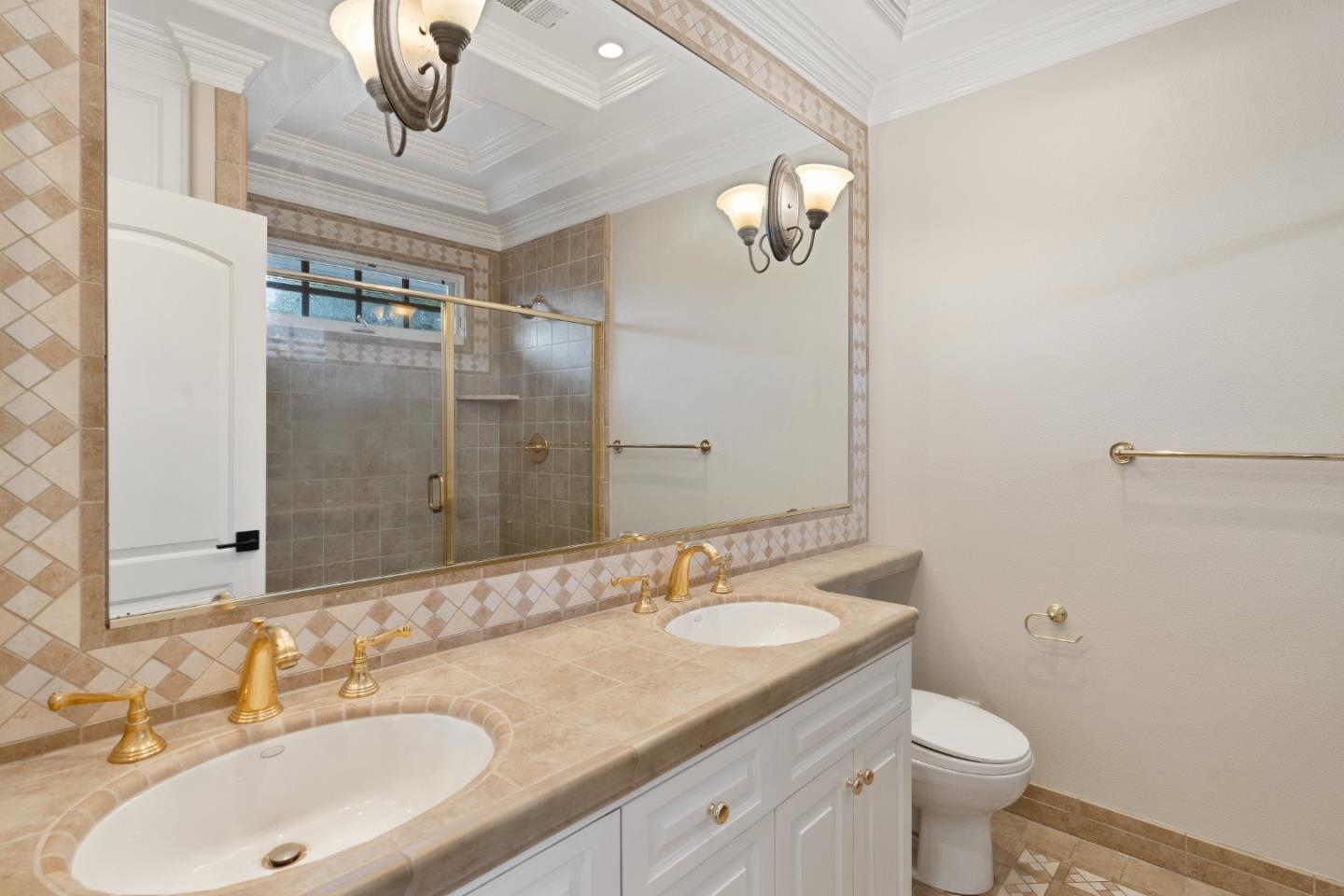 612 Prospect Row San Mateo, CA 94401 - Photo 30 of 54 a bathroom with a granite countertop sink a toilet and a mirror
