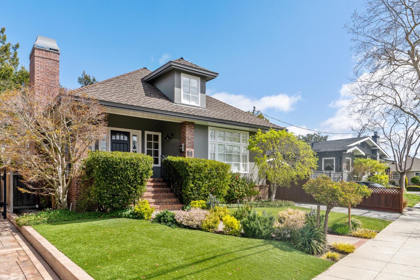 612 Prospect Row San Mateo, CA 94401 - Photo 3 of 54 a front view of a house with garden