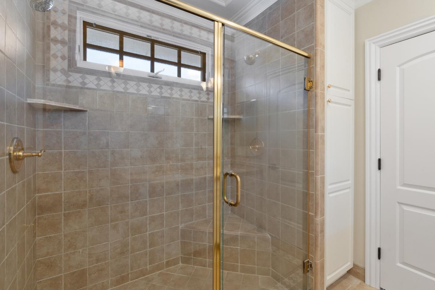 612 Prospect Row San Mateo, CA 94401 - Photo 31 of 54 a bathroom with a glass shower door