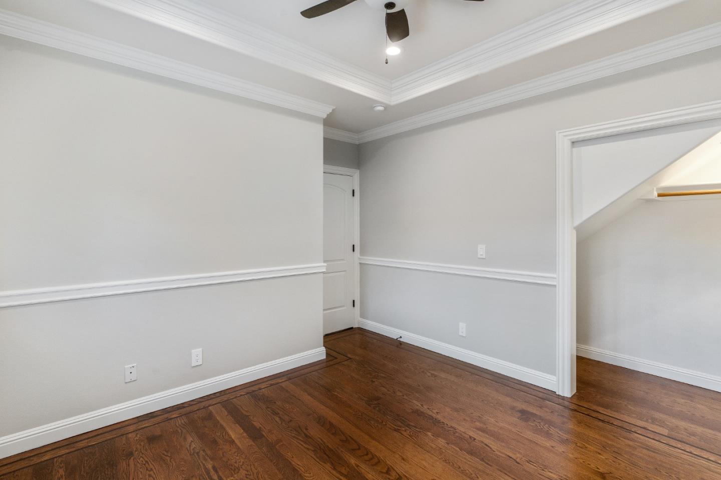 612 Prospect Row San Mateo, CA 94401 - Photo 32 of 54 an empty room with wooden floor and windows