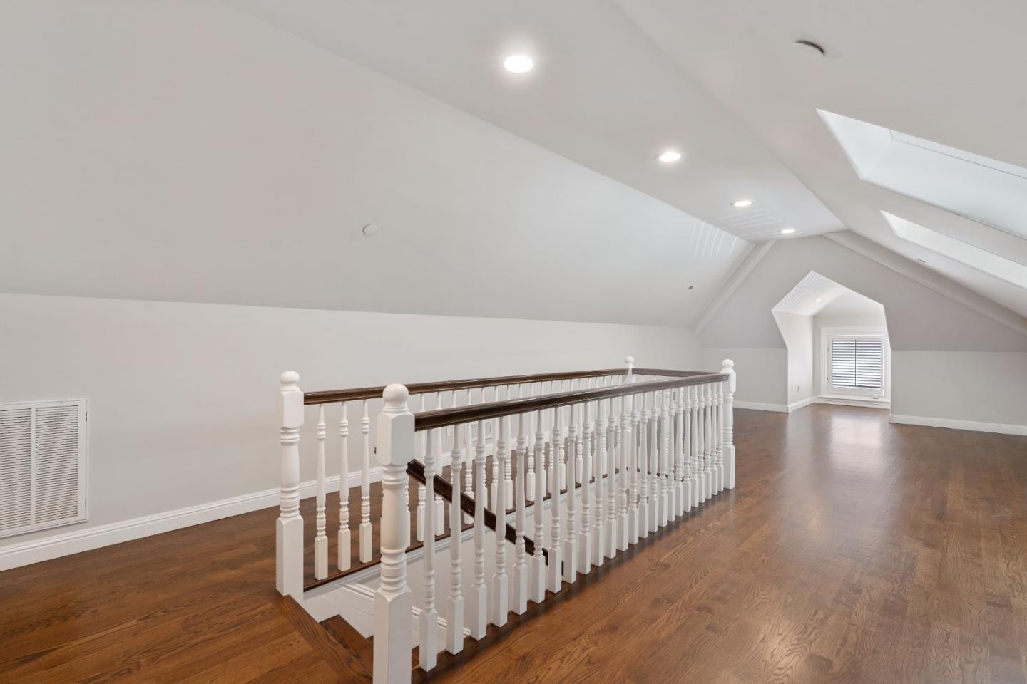 612 Prospect Row San Mateo, CA 94401 - Photo 40 of 54 a view of staircase with wooden floor and fan