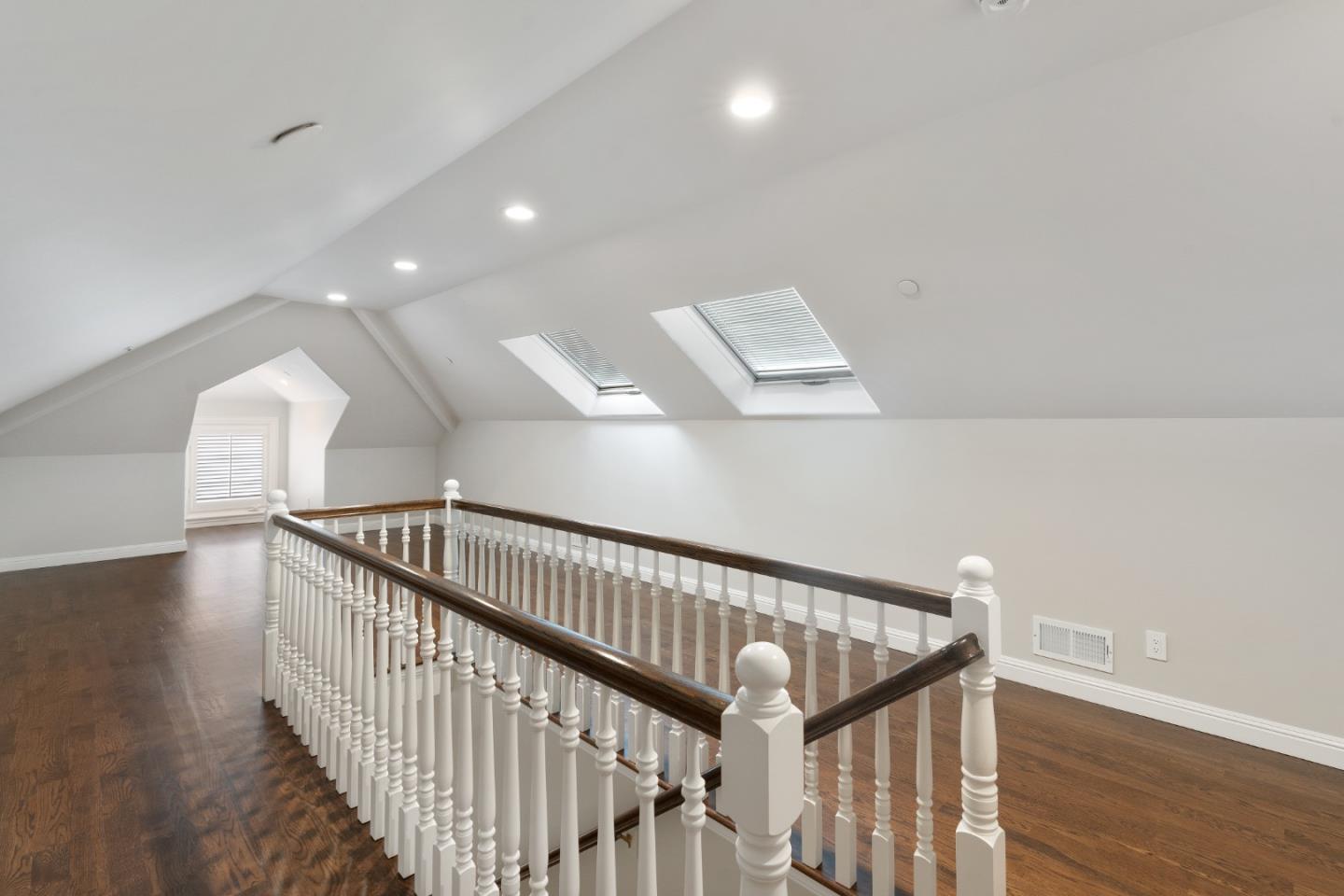 612 Prospect Row San Mateo, CA 94401 - Photo 41 of 54 a view of staircase with wooden floor and fan