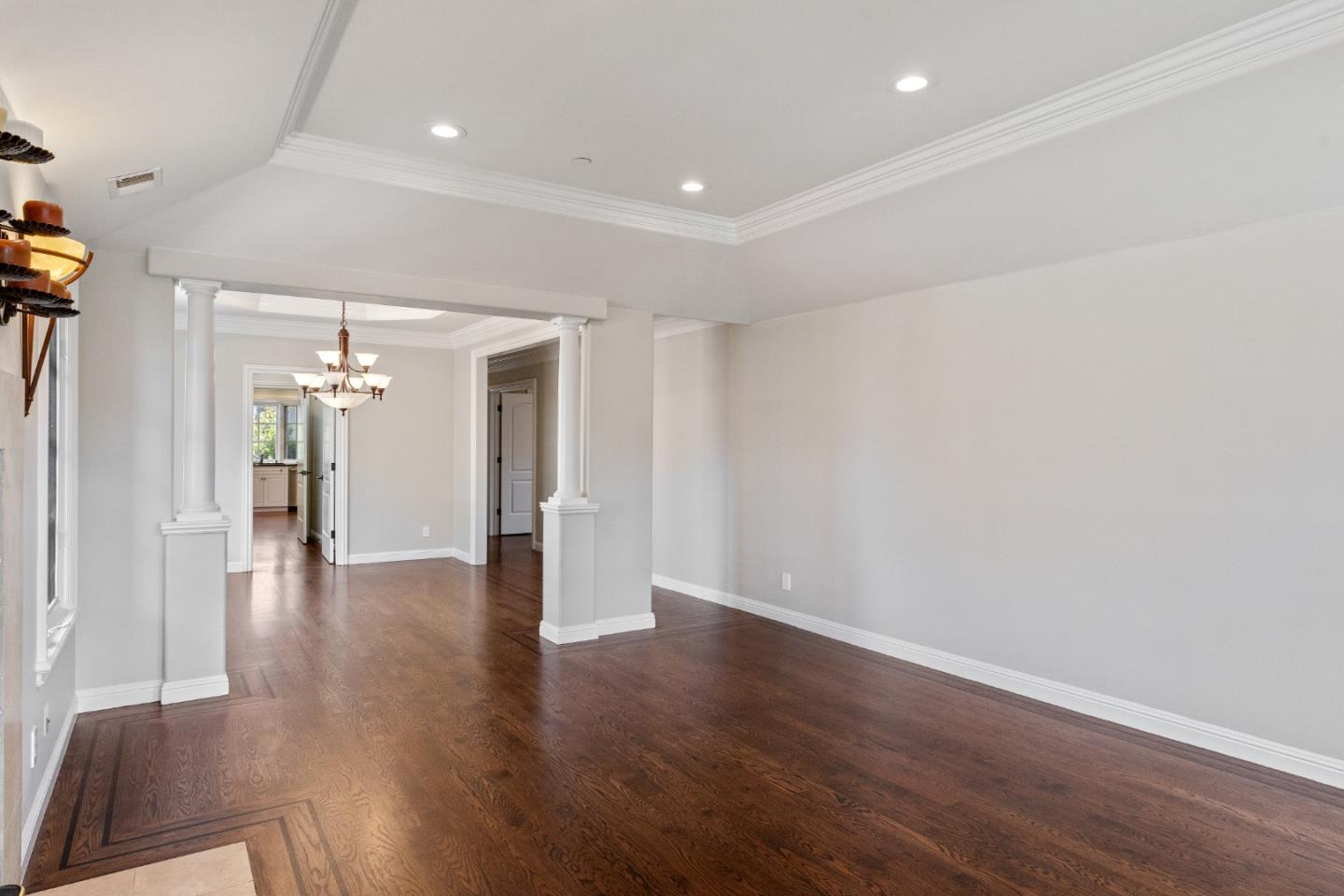 612 Prospect Row San Mateo, CA 94401 - Photo 6 of 54 a view of a hallway with wooden floor