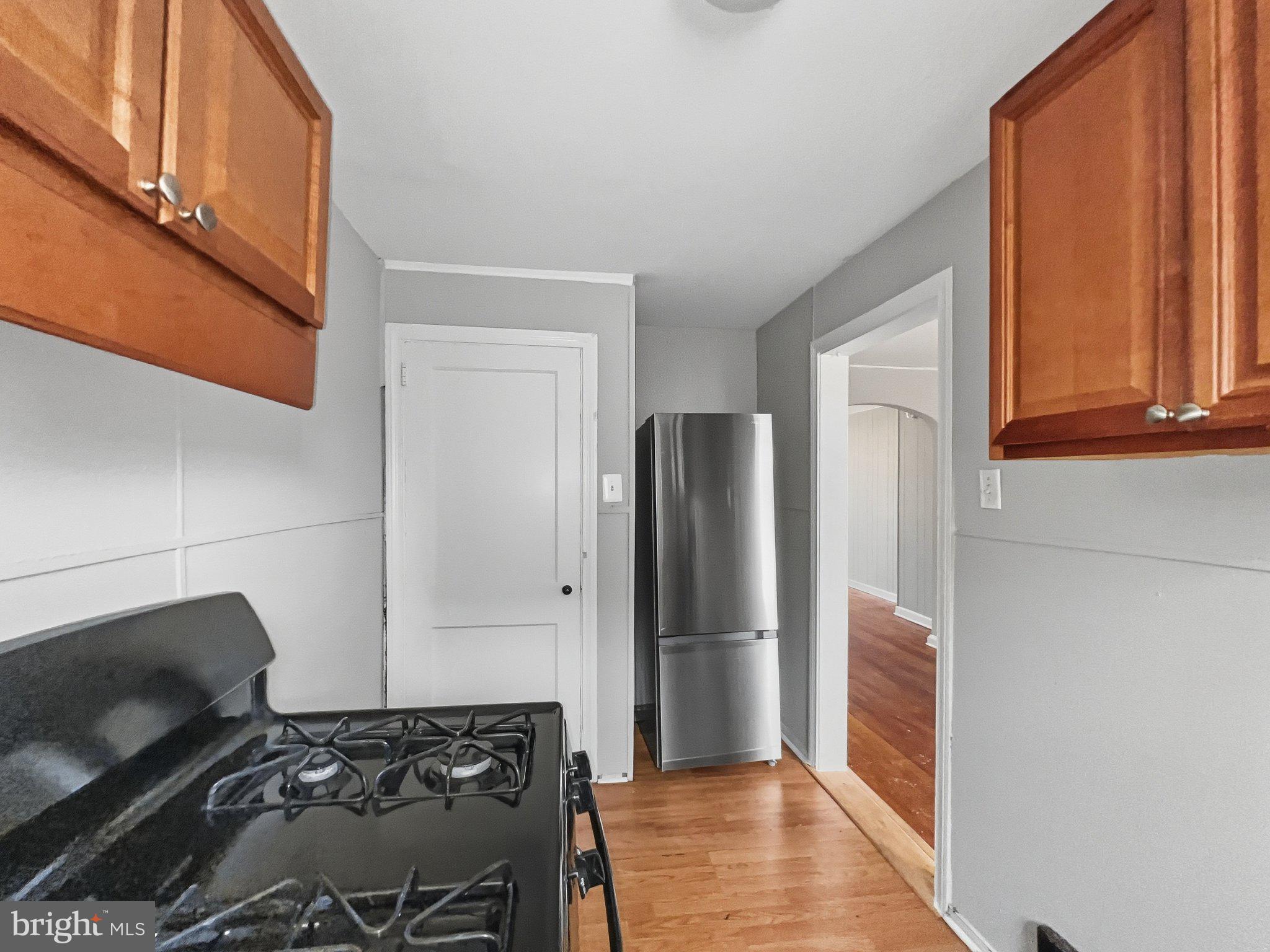 920 Butler Street Chester, PA 19013 - Photo 5 of 10 Modern kitchen with sleek appliances.