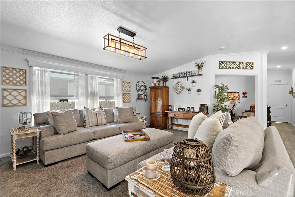 8651 Foothill, Unit 82 Rancho Cucamonga, CA 91730 - Photo 15 of 56 a living room with furniture and a large window