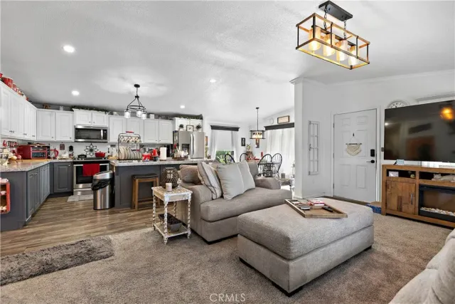 a kitchen with refrigerator and cabinets