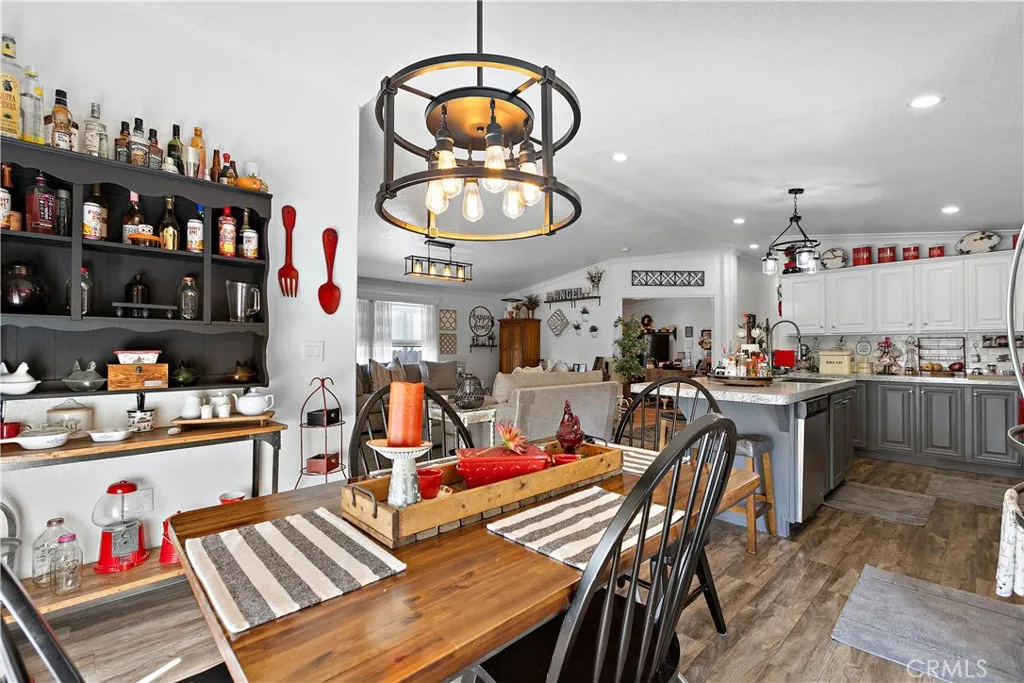 8651 Foothill, Unit 82 Rancho Cucamonga, CA 91730 - Photo 20 of 56 a kitchen view of a dining table chairs and chandelier