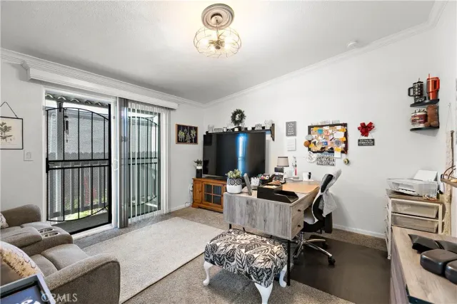 a workspace with furniture and flat screen tv