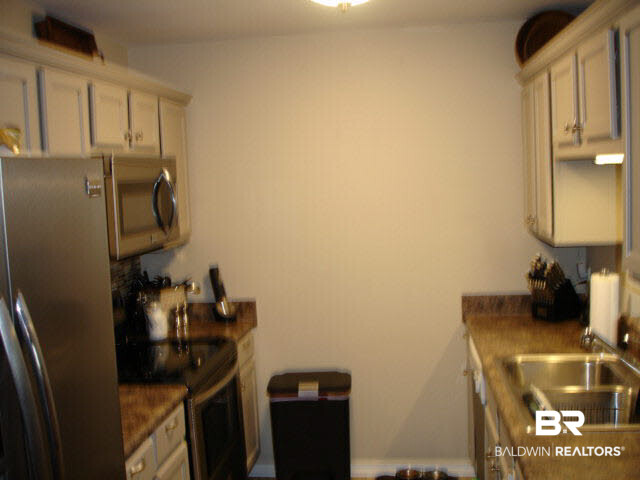 1517 Regency Road, Unit 123 Gulf Shores, AL 36542 - Photo 10 of 31 NICE GALLEY KITCHEN