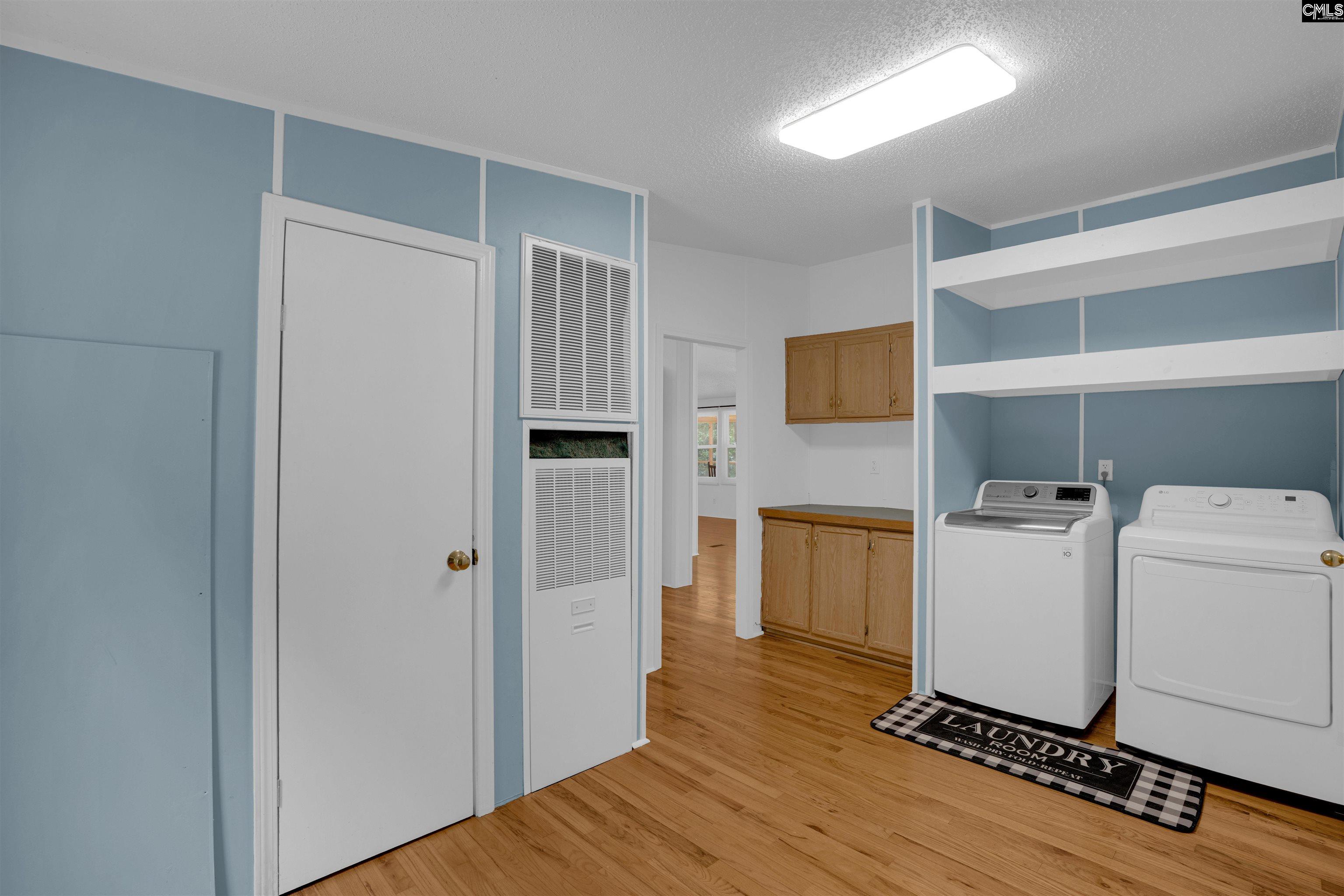 304 Cooper Road Blythewood, SC 29016 - Photo 21 of 29 a room with a refrigerator and a stove top oven