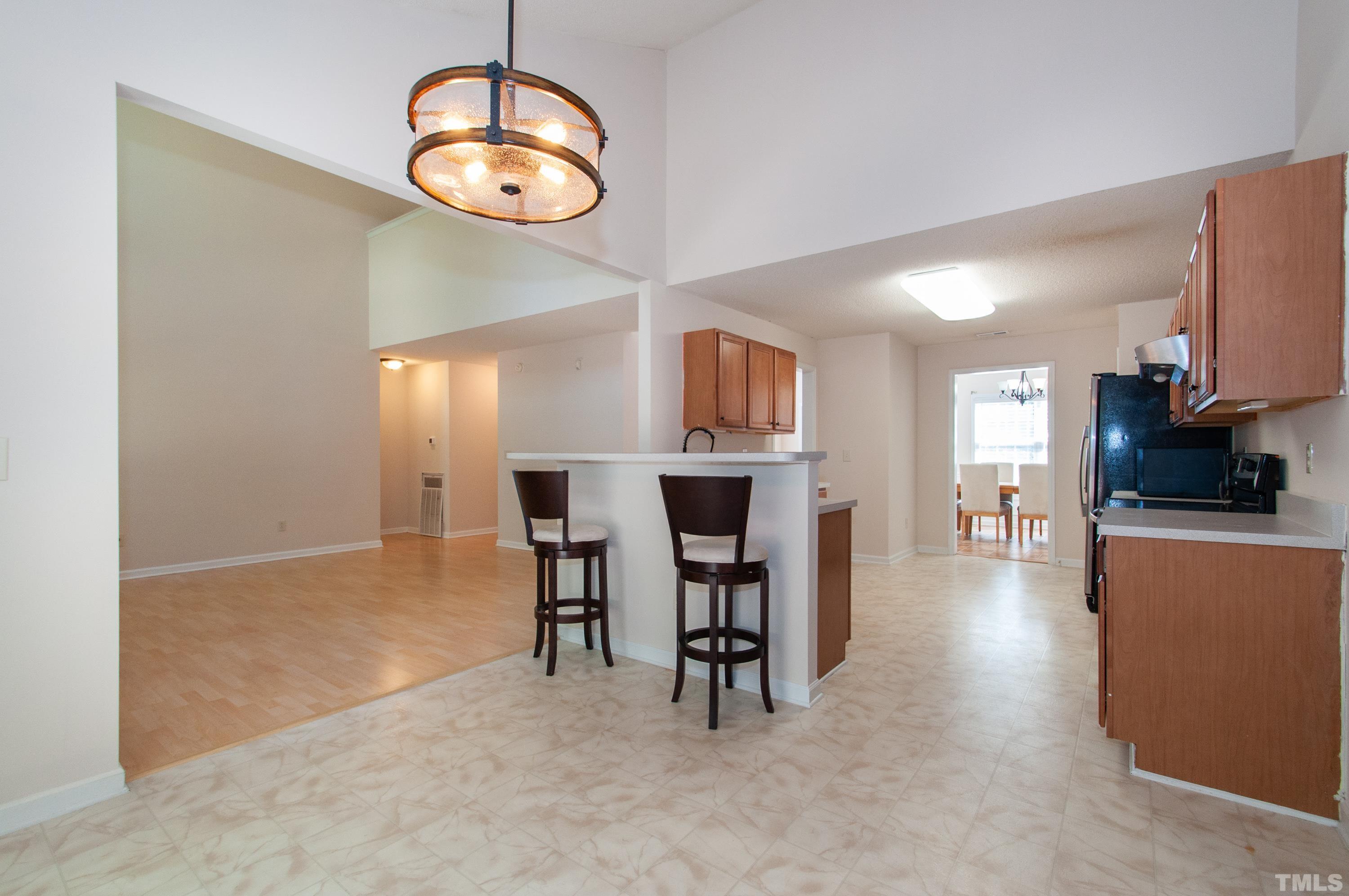 4617 Dresden Village Drive Raleigh, NC 27604 - Photo 14 of 33 a view of a livingroom with furniture a fireplace