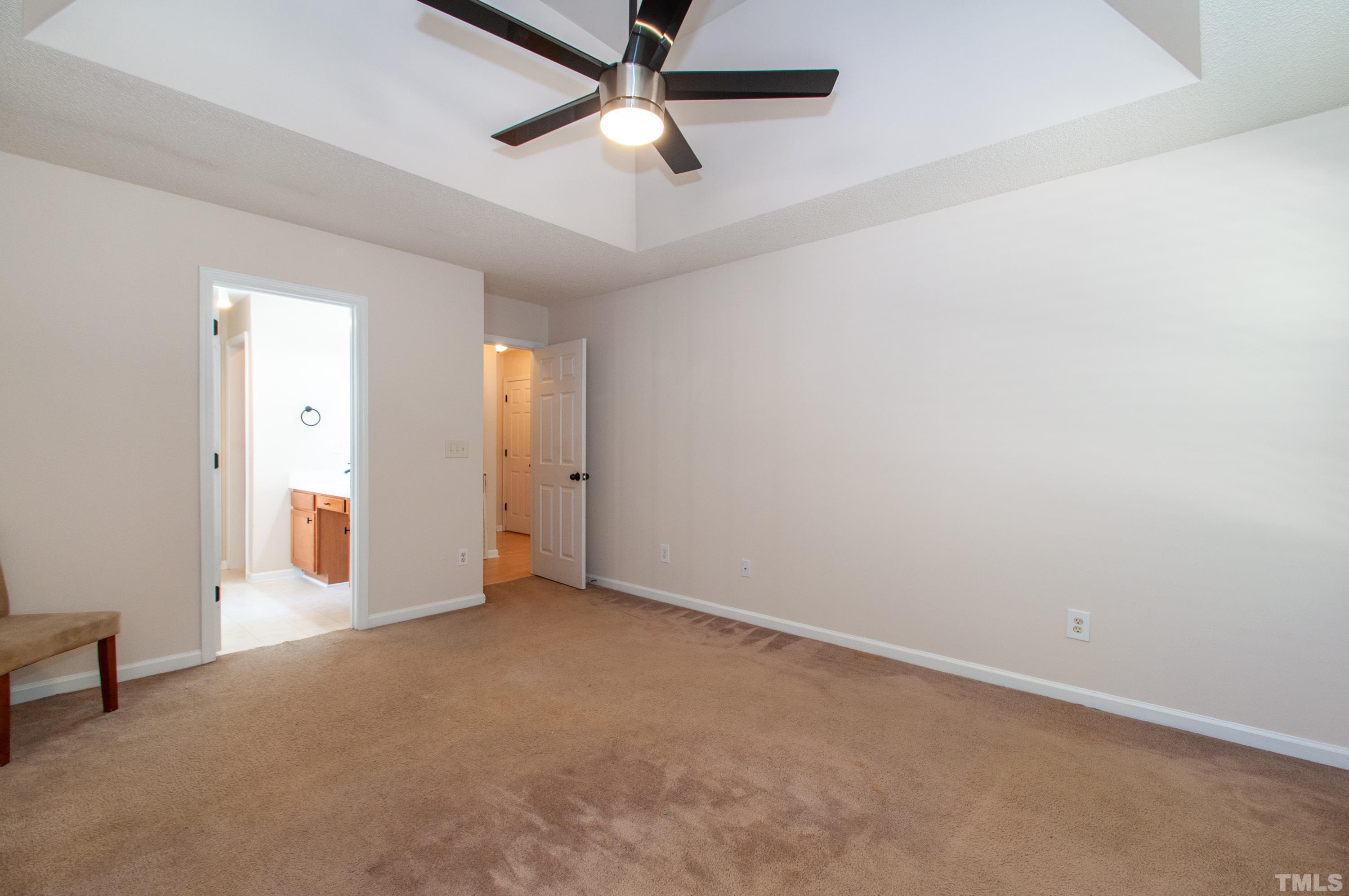 4617 Dresden Village Drive Raleigh, NC 27604 - Photo 16 of 33 an empty room with chandelier fan