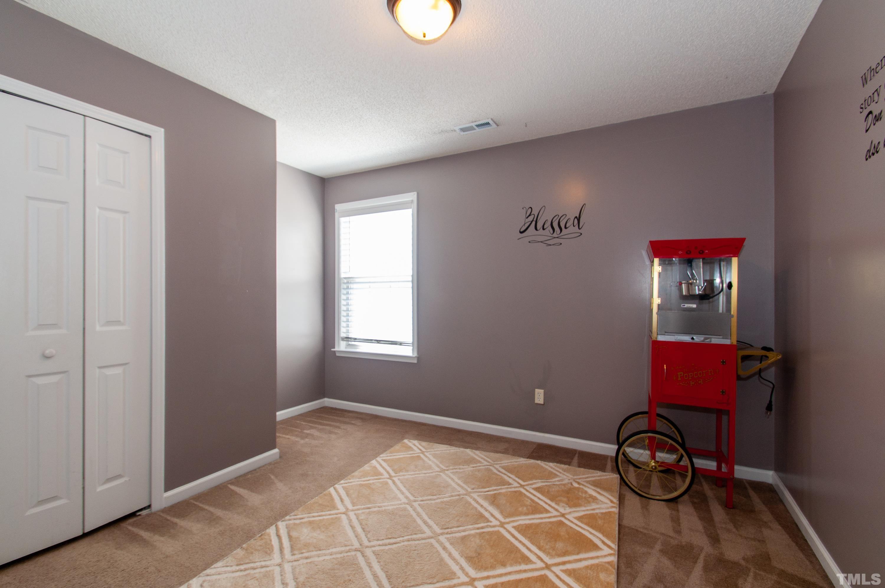 4617 Dresden Village Drive Raleigh, NC 27604 - Photo 20 of 33 a room with furniture and a window