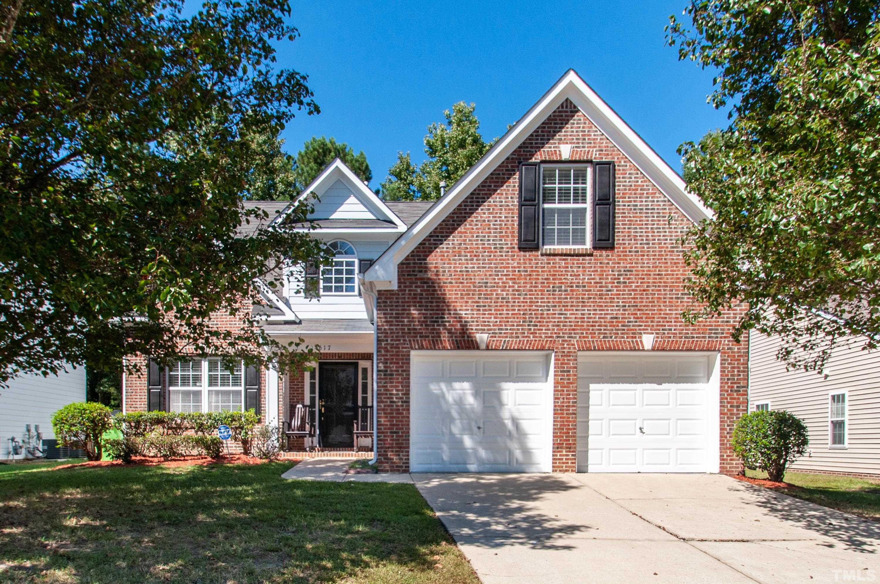 4617 Dresden Village Drive Raleigh, NC 27604 - Photo 2 of 33 a front view of a house with garden