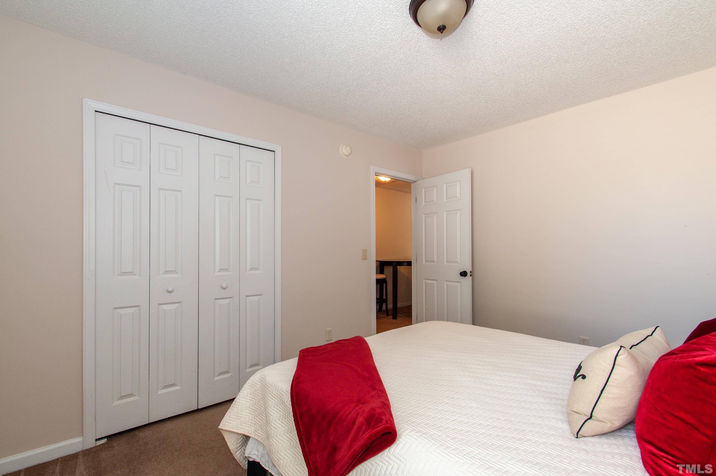 4617 Dresden Village Drive Raleigh, NC 27604 - Photo 22 of 33 a bedroom with a bed and a window