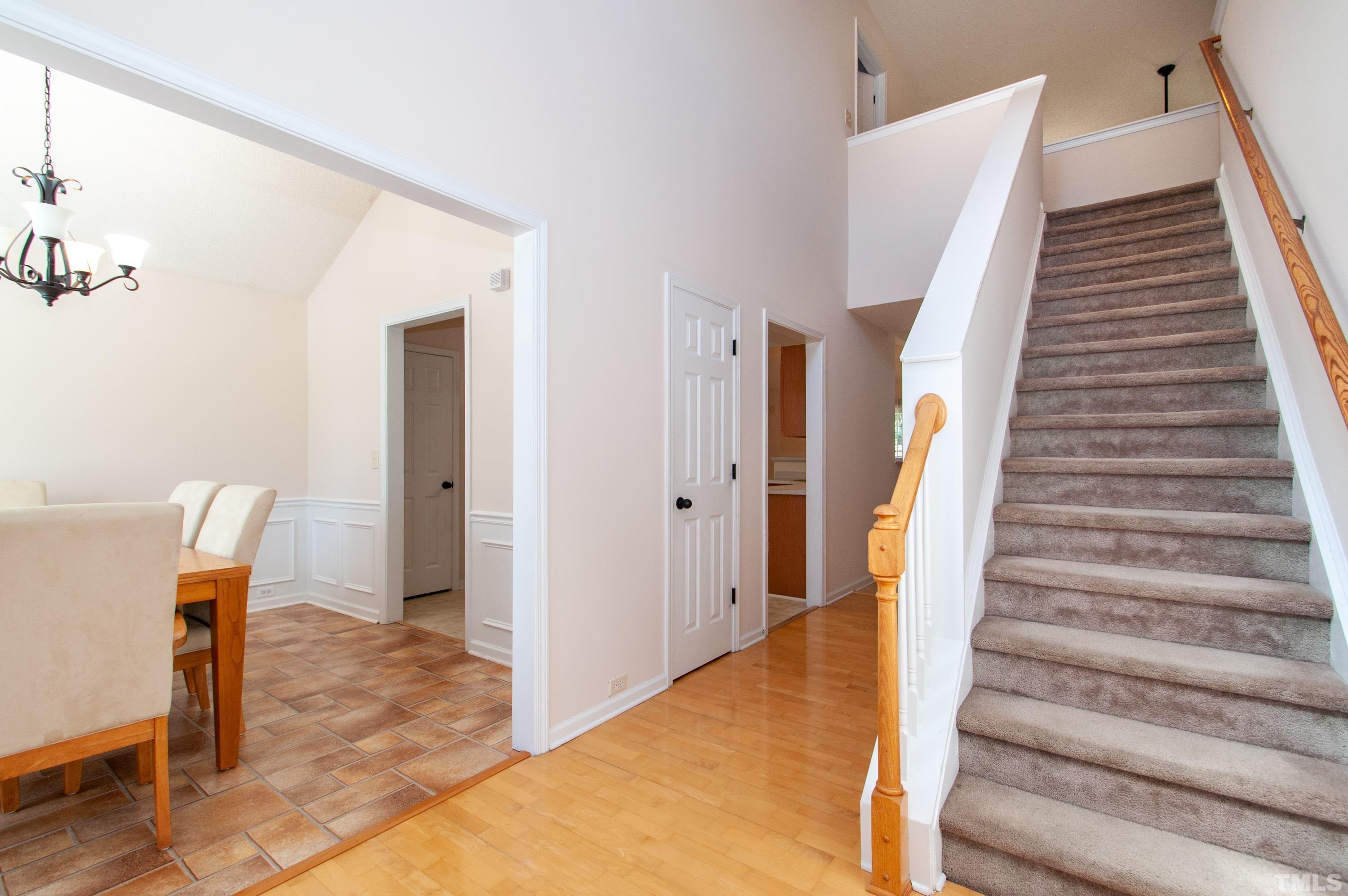 4617 Dresden Village Drive Raleigh, NC 27604 - Photo 7 of 33 a view of a livingroom with wooden floor and stairs