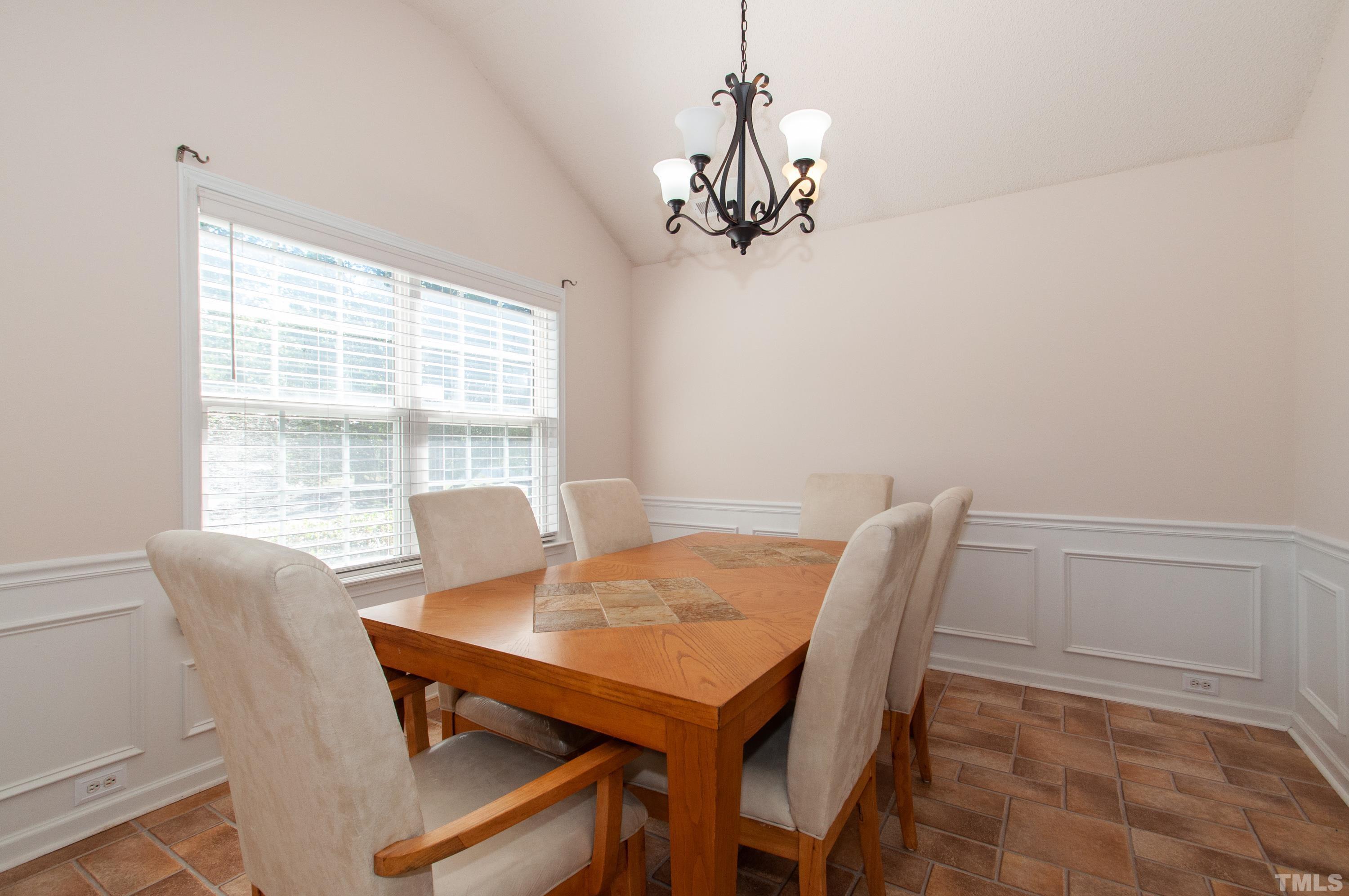 4617 Dresden Village Drive Raleigh, NC 27604 - Photo 8 of 33 a view of a dining room with furniture window and outside view
