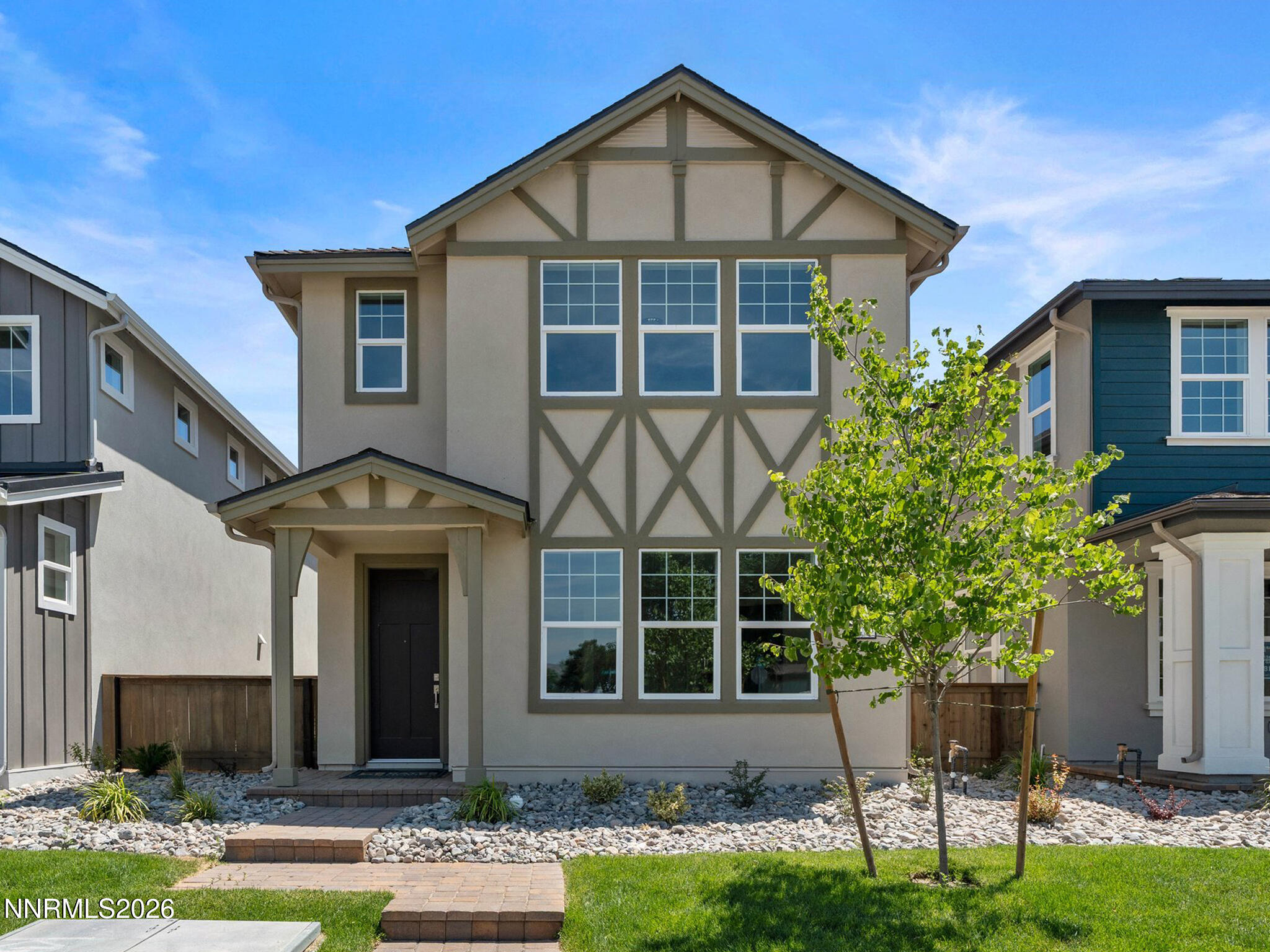 1371 Vine Gate Road, Unit HOMESITE 49 Carson City, NV 89701 - Photo 1 of 24 a front view of a house with a yard and porch