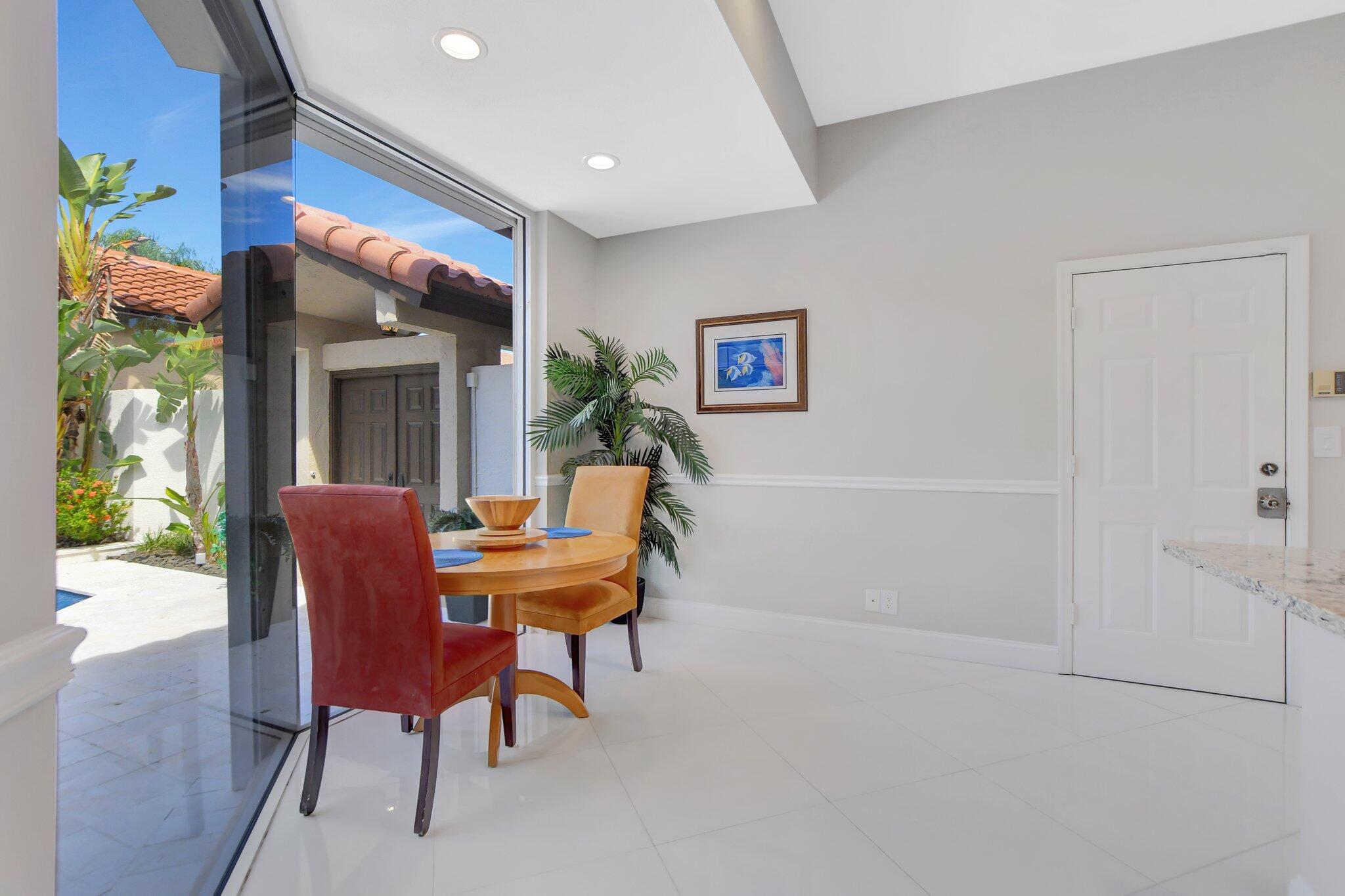 23164 Via Stel Boca Raton, FL 33433 - Photo 13 of 31 a view of a dining room with furniture and a potted plant
