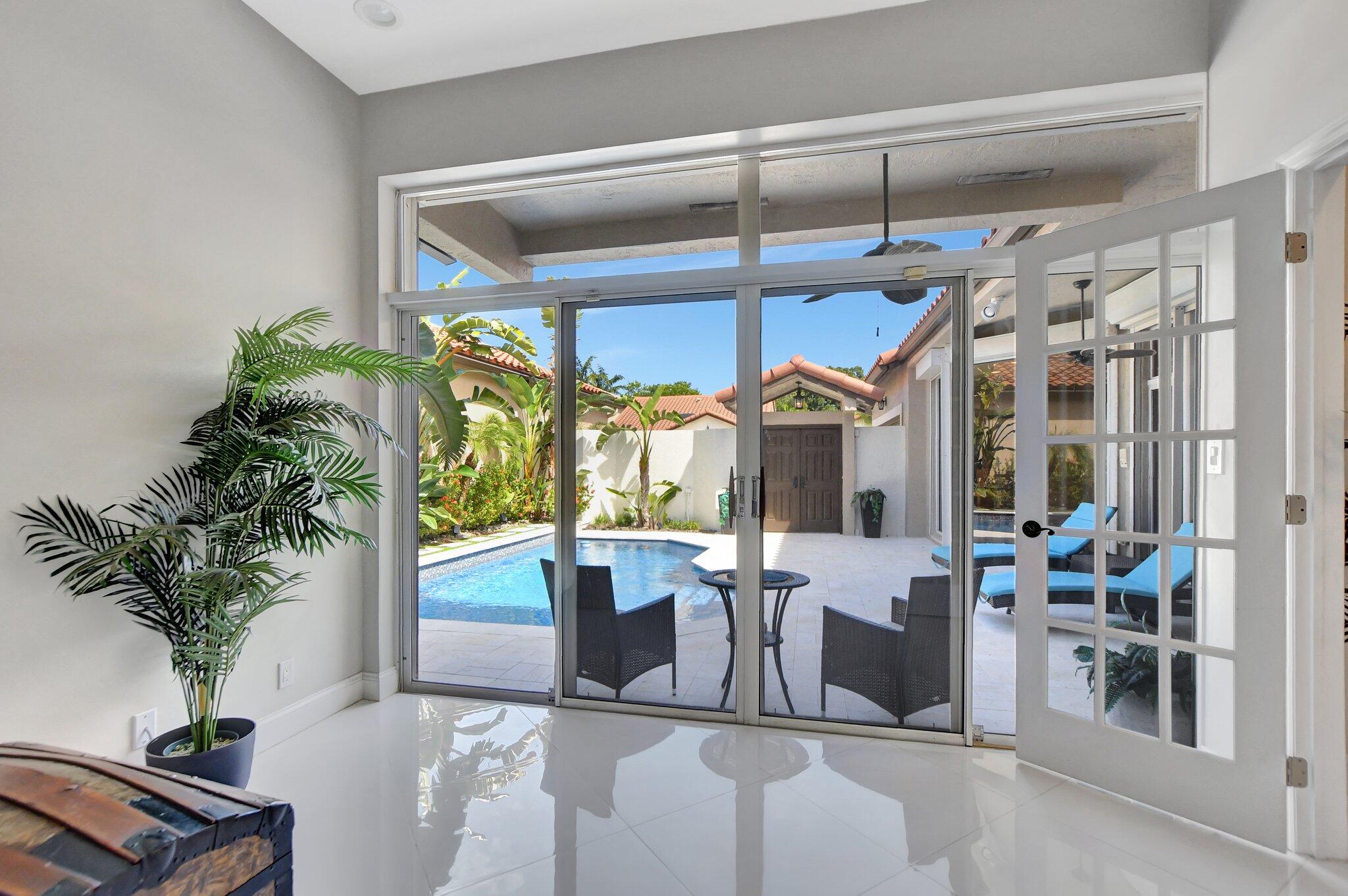 23164 Via Stel Boca Raton, FL 33433 - Photo 14 of 31 a view of a dining room with furniture window and wooden floor