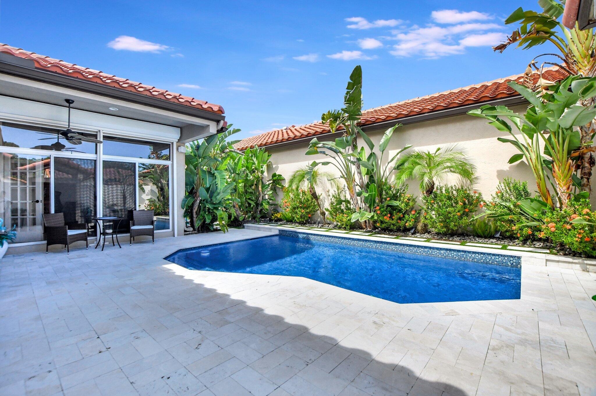 23164 Via Stel Boca Raton, FL 33433 - Photo 2 of 31 a view of outdoor space and swimming pool