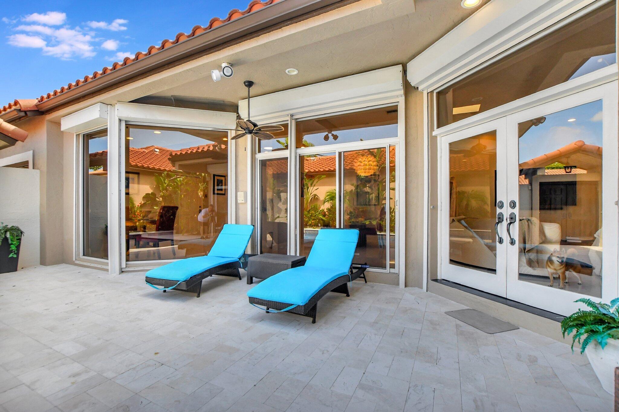 23164 Via Stel Boca Raton, FL 33433 - Photo 26 of 31 a view of an chairs in front of building