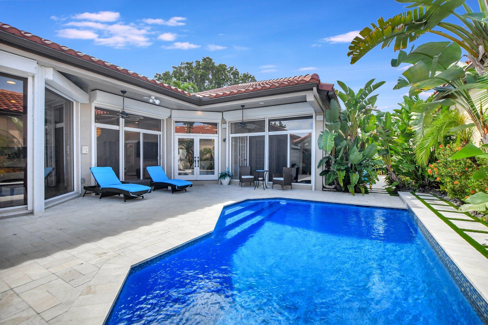 23164 Via Stel Boca Raton, FL 33433 - Photo 28 of 31 a view of a house with pool and sitting area