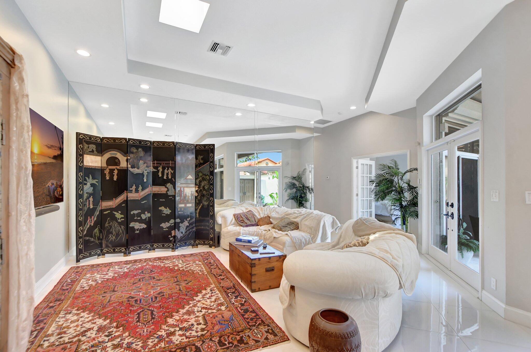 23164 Via Stel Boca Raton, FL 33433 - Photo 4 of 31 a living room with furniture a window and a rug