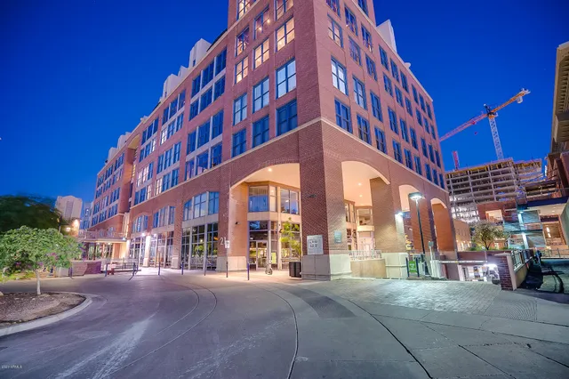a view of a building with a yard