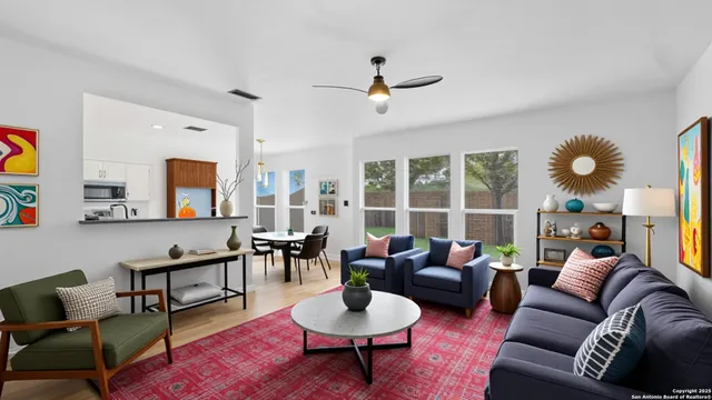 a living room with furniture and a large window
