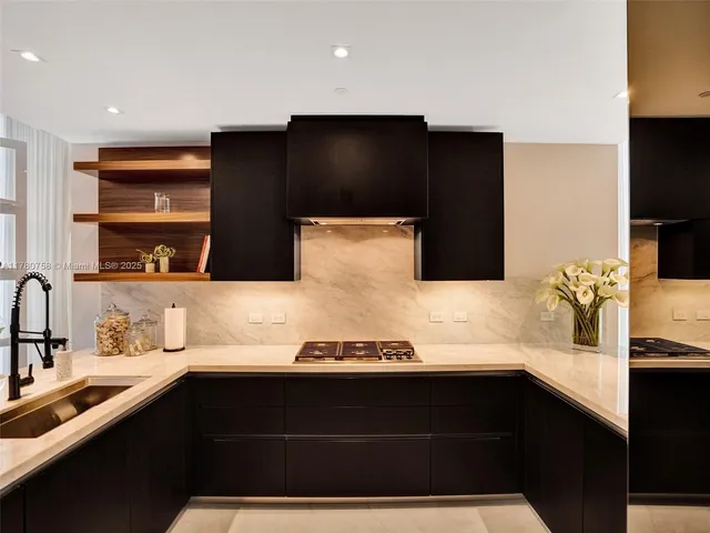 a kitchen with a sink and a refrigerator