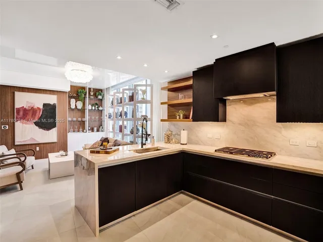 a kitchen with a sink and cabinets