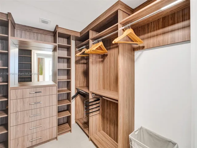 a bathroom with a shower and a sink