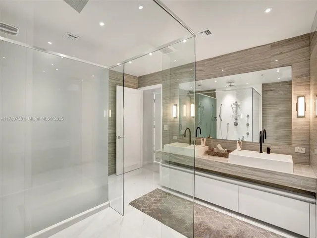 a bathroom with a toilet a sink and a mirror