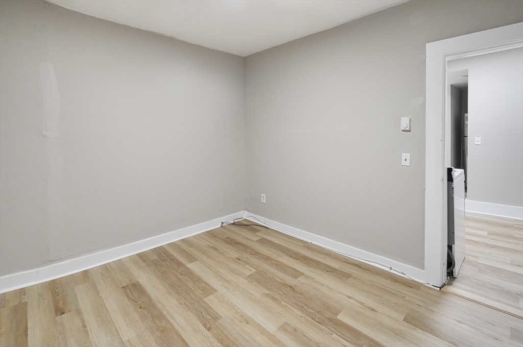 24 Charlton Street, Unit 7 Worcester, MA 01608 - Photo 11 of 17 wooden floor in an empty room
