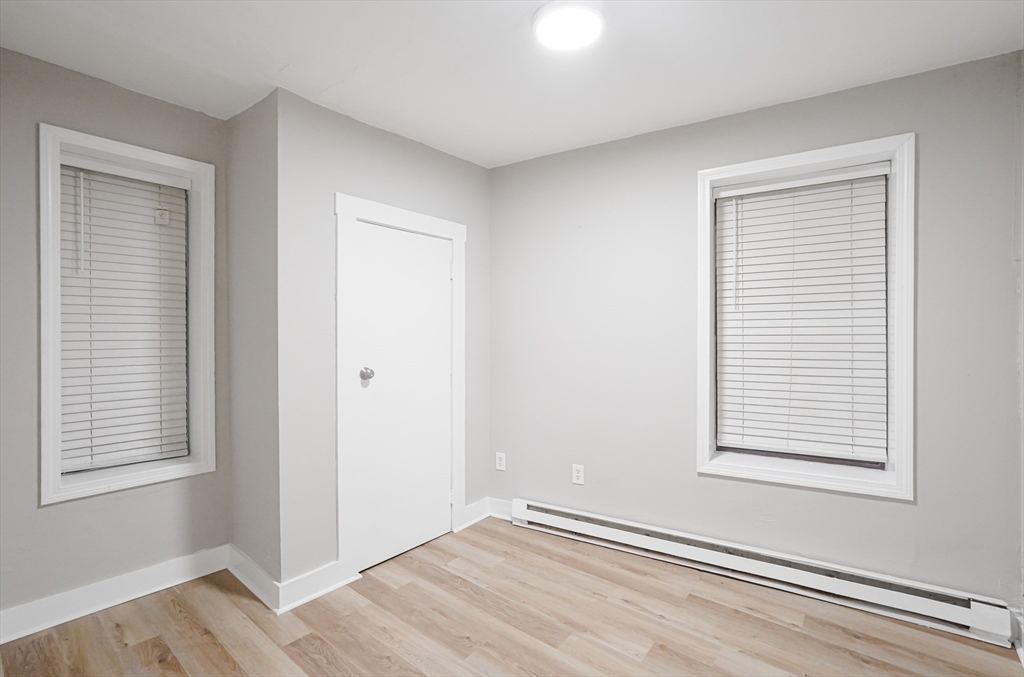 24 Charlton Street, Unit 7 Worcester, MA 01608 - Photo 14 of 17 an empty room with windows