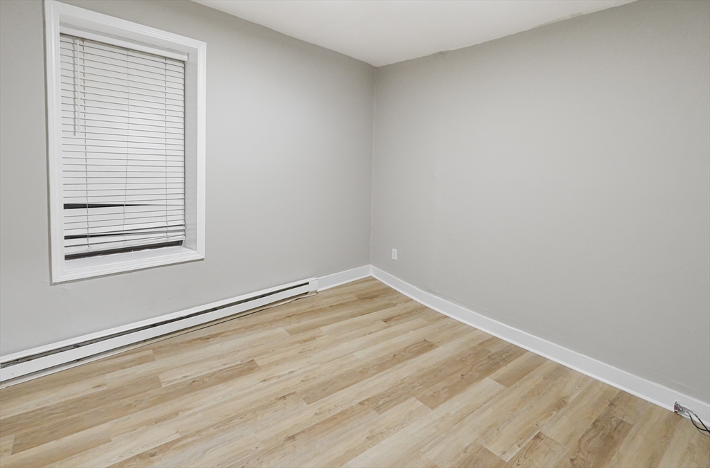 24 Charlton Street, Unit 7 Worcester, MA 01608 - Photo 10 of 17 a view of a room that has a window in it