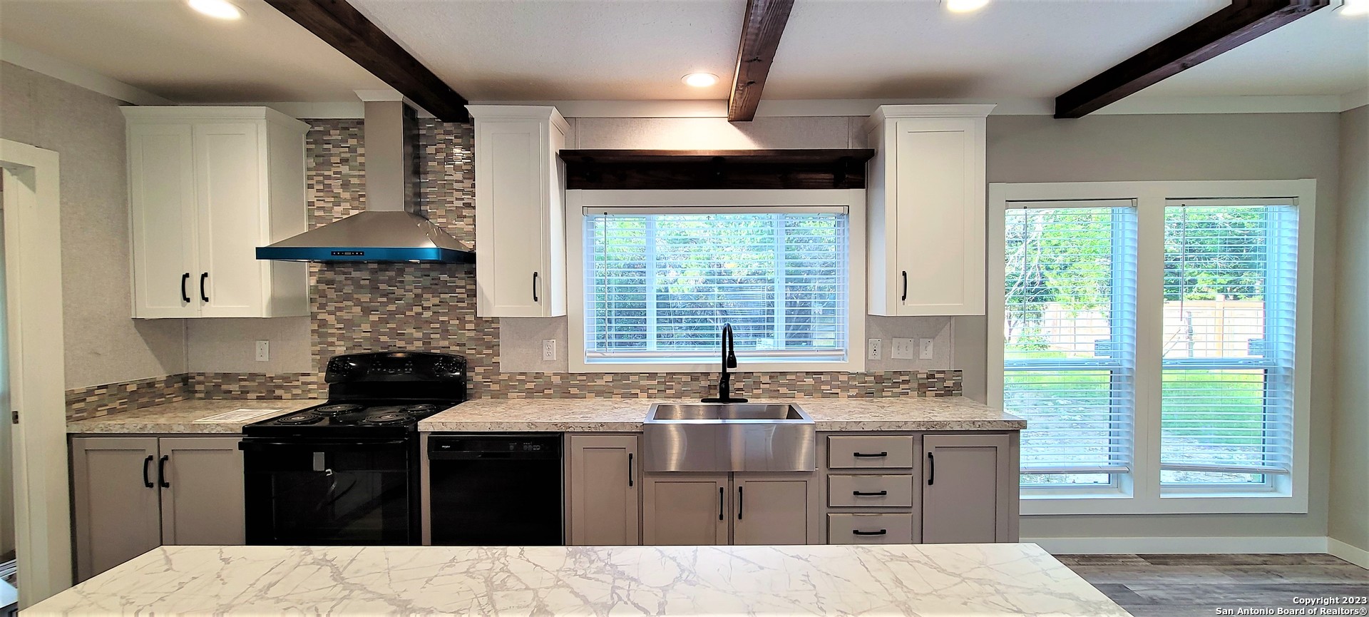 a kitchen with a stove and a sink