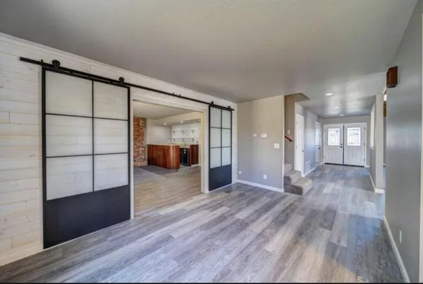 a view of entryway with wooden floor