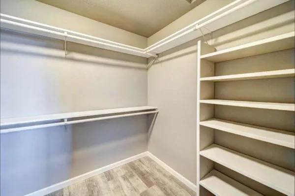 a view of an empty walk in closet