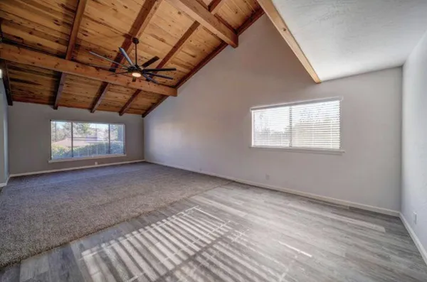 a view of an empty room with a window