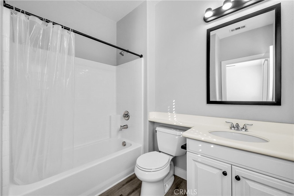 8415 Kendra Loop Orange, CA 92867 - Photo 20 of 36 a bathroom with a granite countertop sink a toilet and shower