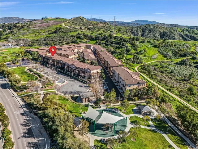 a view of an empty room with window and fire place