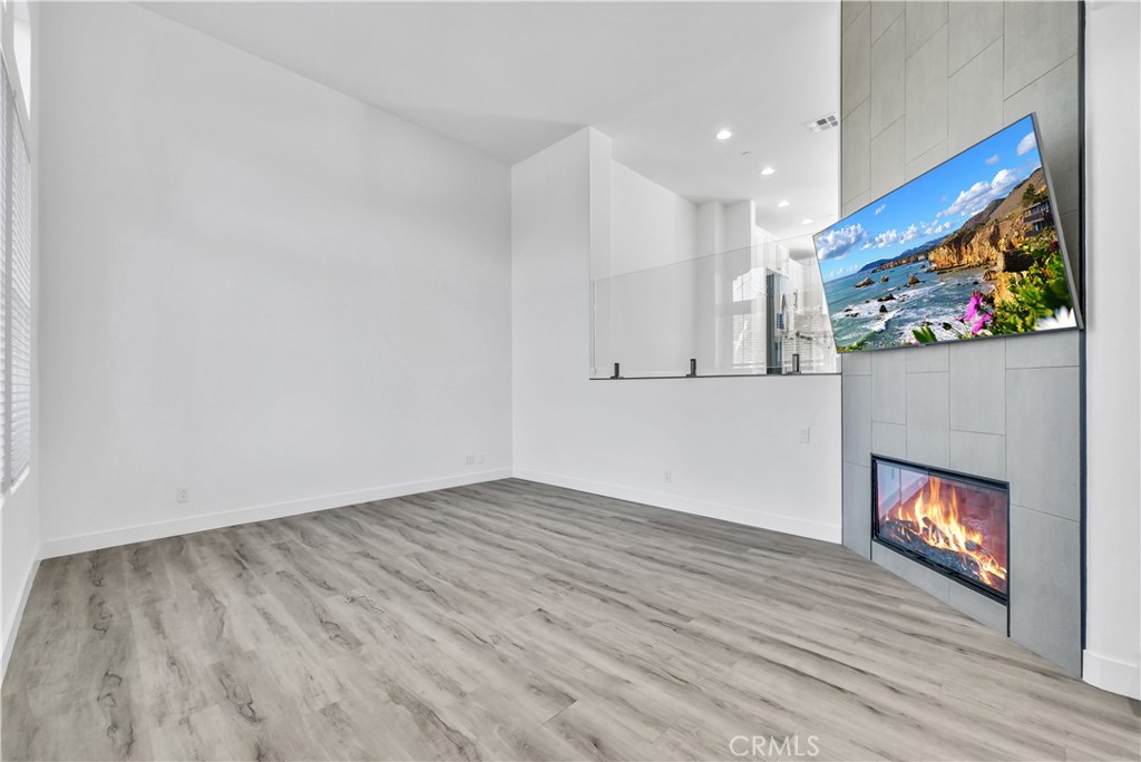 8415 Kendra Loop Orange, CA 92867 - Photo 5 of 36 a view of an empty room and wooden floor