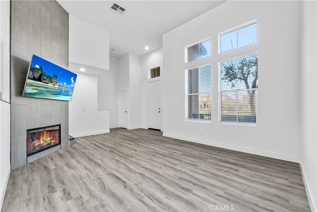 8415 Kendra Loop Orange, CA 92867 - Photo 7 of 36 a view of an empty room with window and fire place