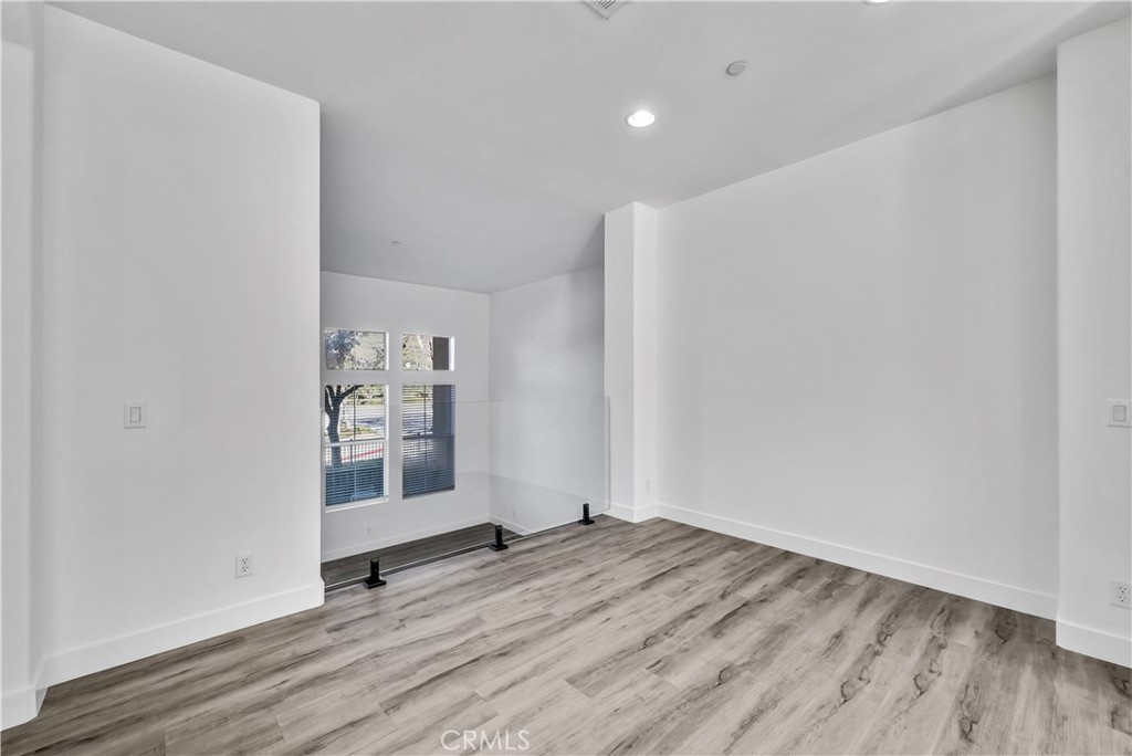 8415 Kendra Loop Orange, CA 92867 - Photo 10 of 36 a view of wooden floor and windows in a room